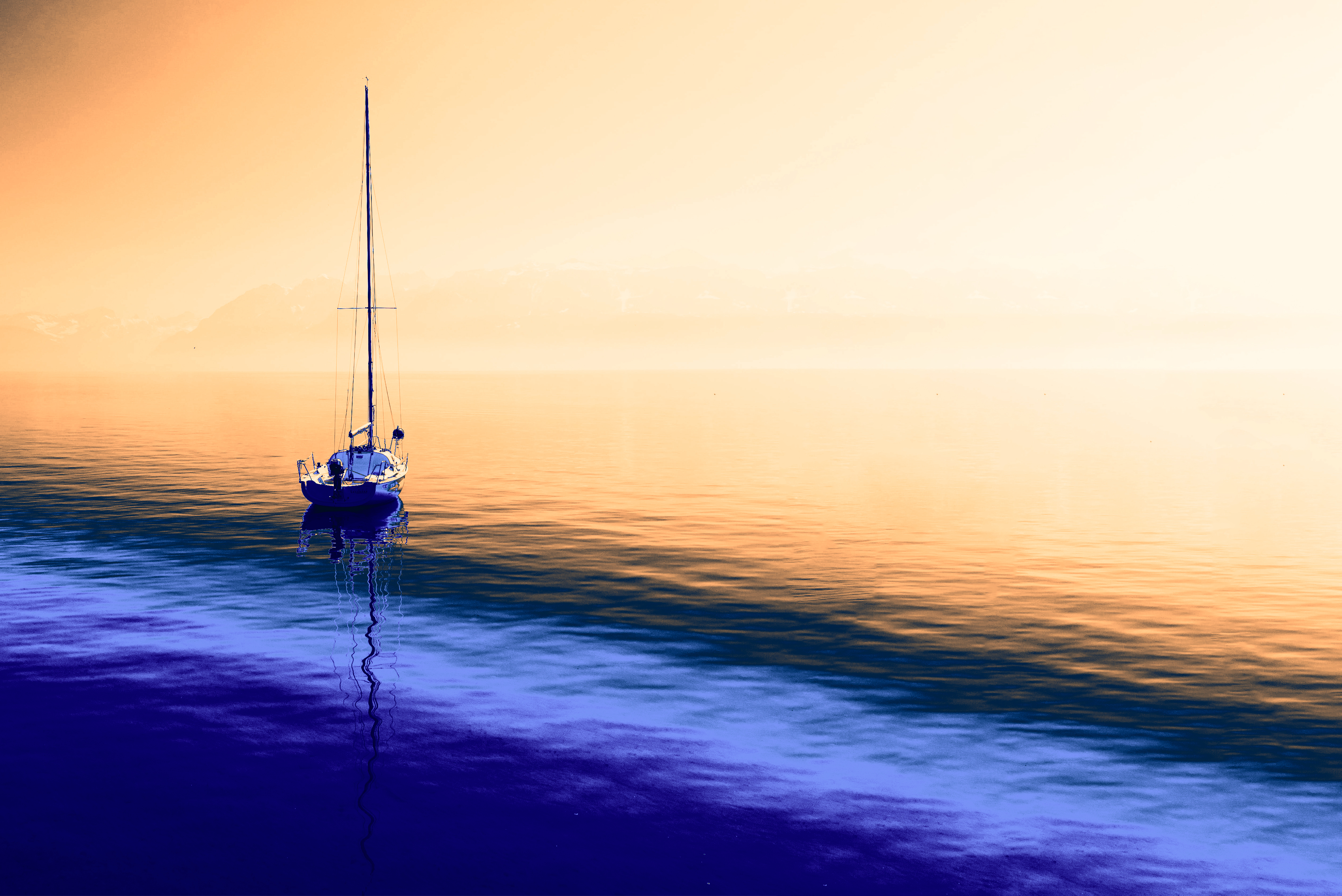 Monogramme du cabinet de Nicolas Sabarly sur fond de peinture liquide bleue